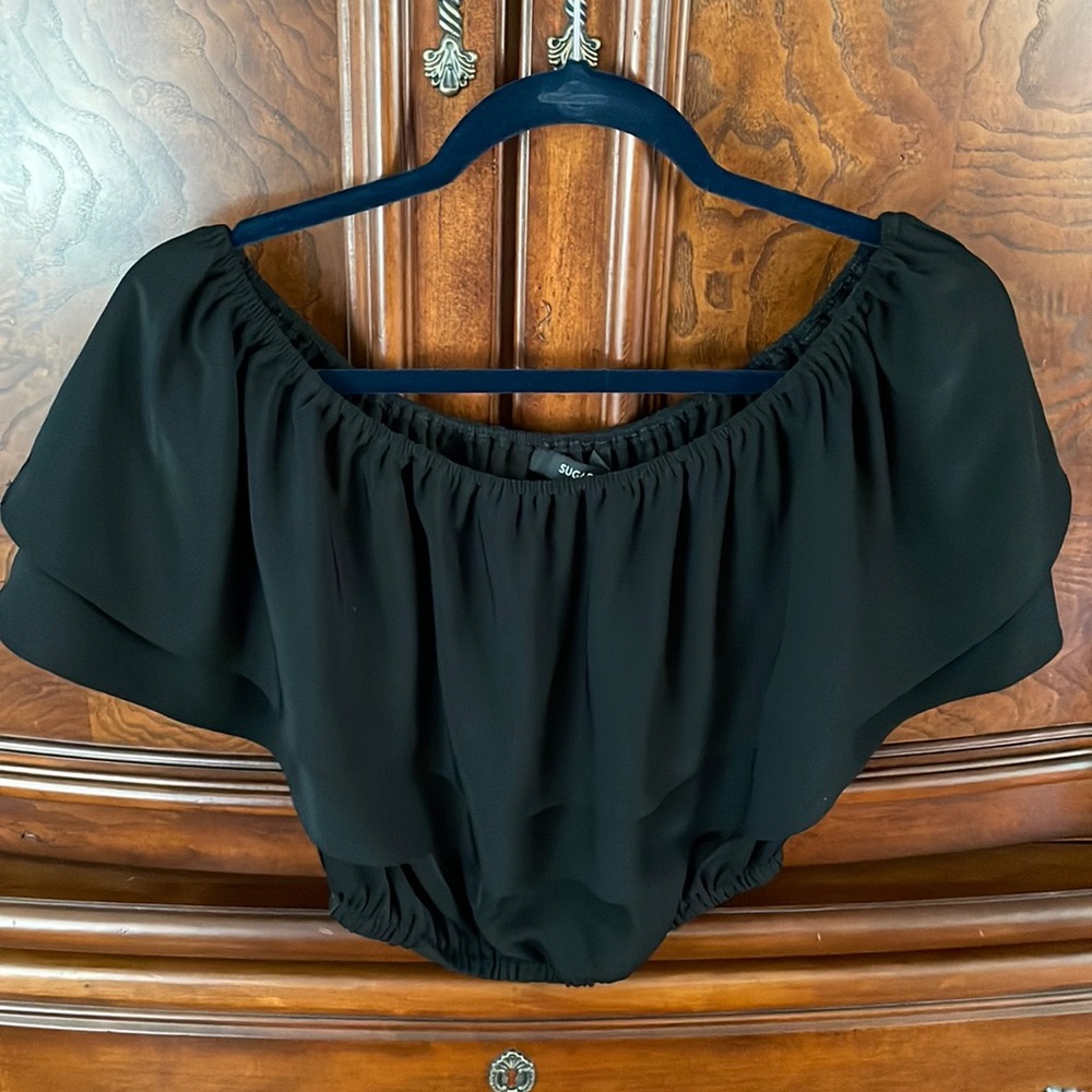 Black ruffle off shoulder beautiful shirt. Size XS. Never worn.